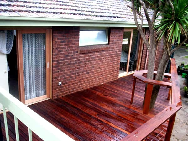 timber decking with tree and railing built around tree in melbourne